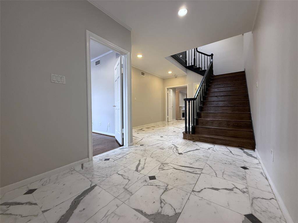 Welcome home! The spacious entry greets you with marble flooring.
