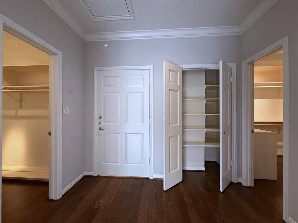 On either side of the primary suit entry is a walk-in closet