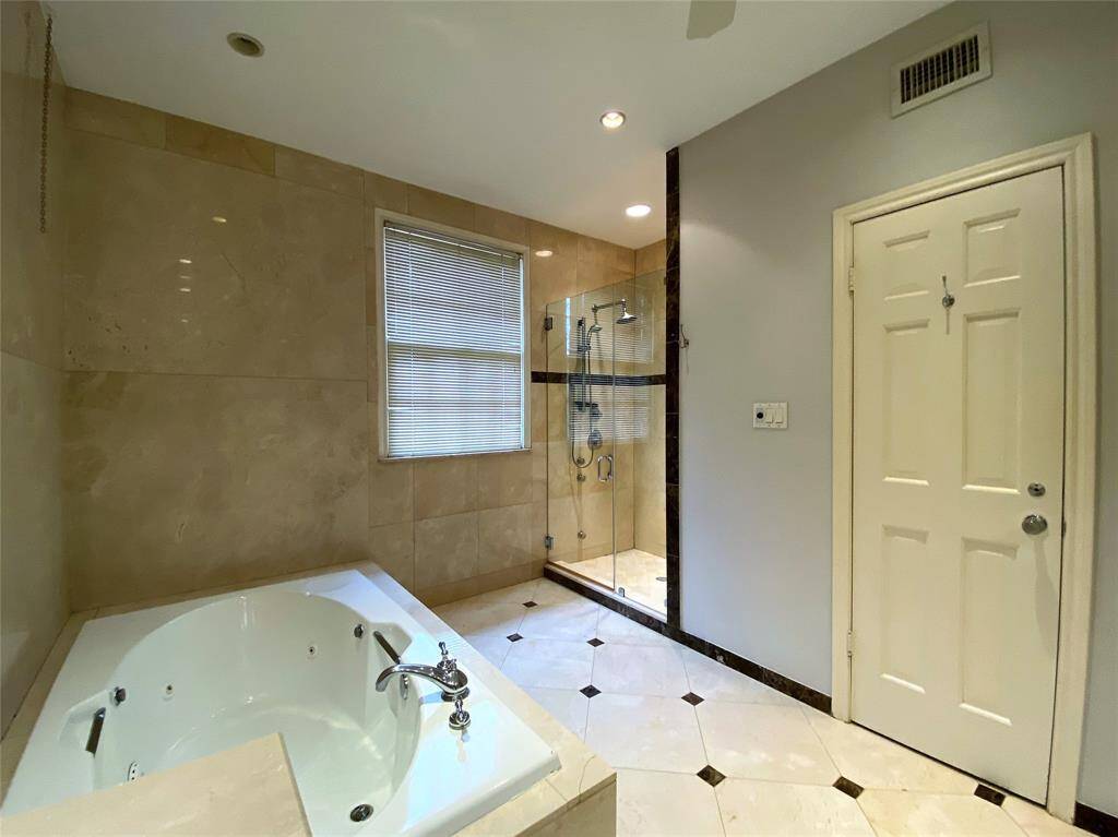 Separate shower. Behind the door on the right is the water closet with toilet and bidet.