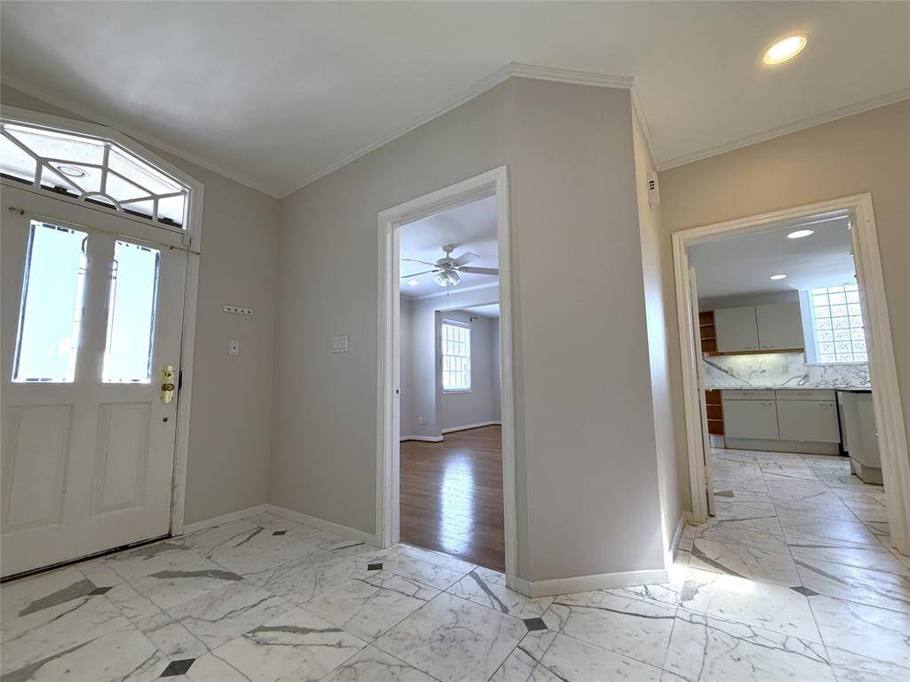 Immediately by the front door is the home office/bonus room and one of the entries into the kitchen.