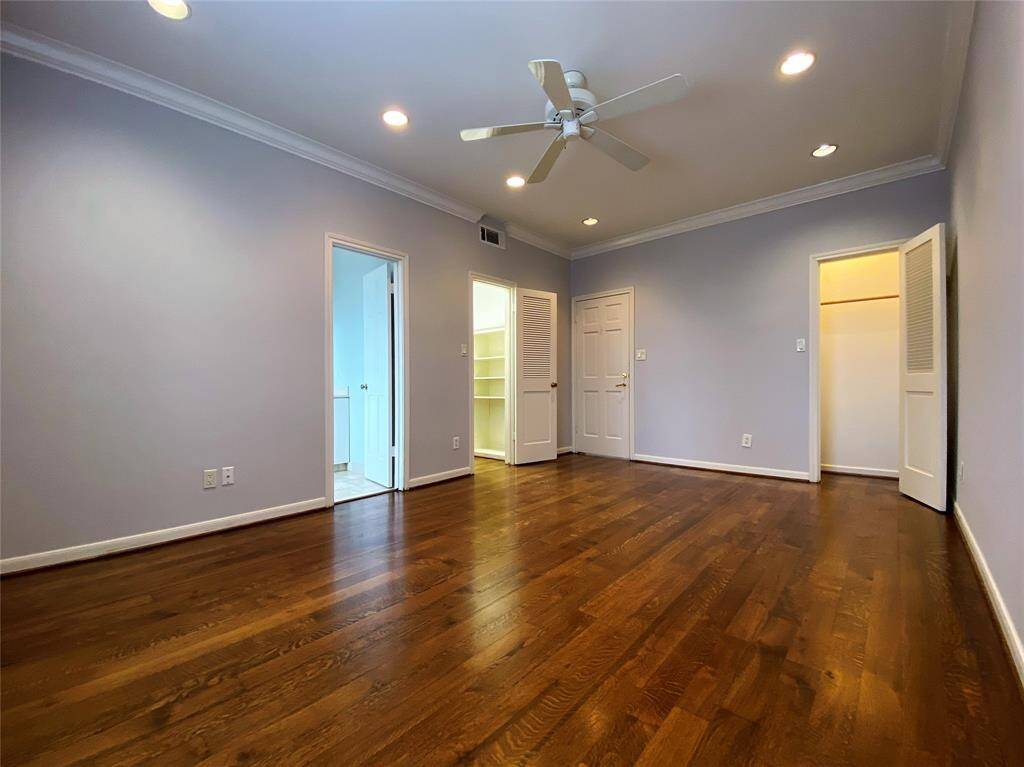 With ceiling fan and recessed lighting, the 1st secondary bedroom offers two closets and a private bath.