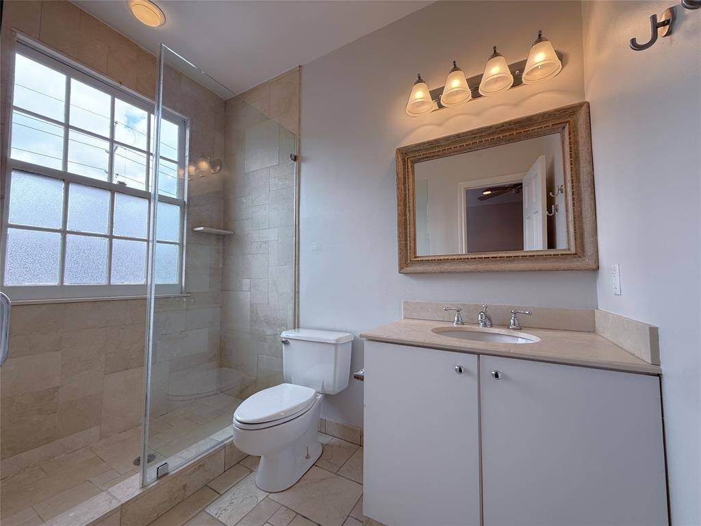 Vanity with storage & nicely sized shower.