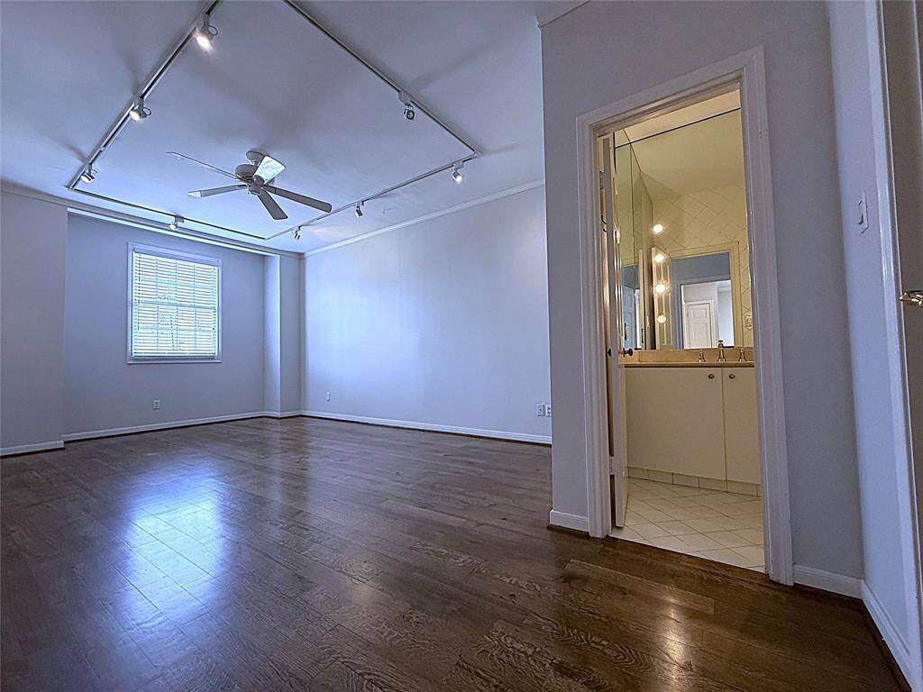 The 2nd secondary bedroom offers a private bath, ceiling fan & tract lighting.