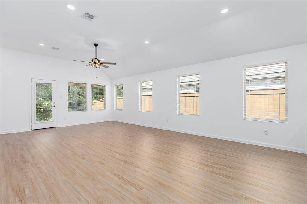 Grand Living and Dining Area with wall of windows