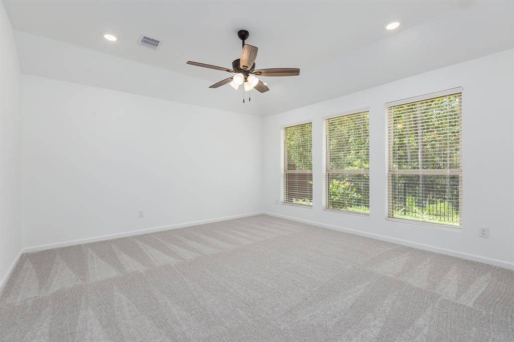 Primary Bedroom with view of the woods
