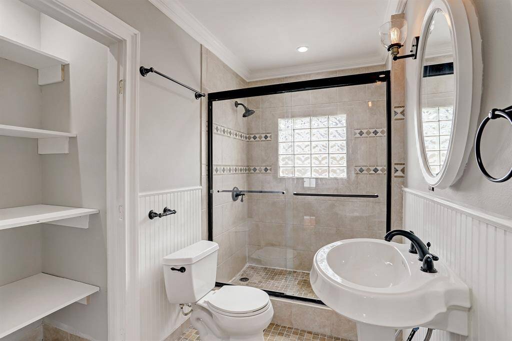 OVERSIZED WALK IN SHOWER WITH BENCH IN THIS APPEALING RESTROOM WITH NO DETAILS MISSING!