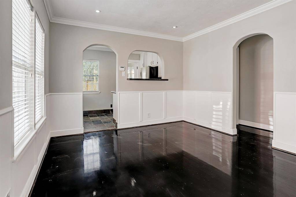 LUSH GRANITE ADORNS THE COUNTERTOPS WITH FRENCH DOOR LEADING TO LARGE UTILITY ROOM!