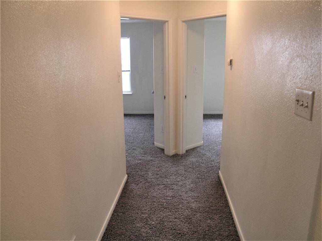 Hall to Primary Bedroom and 3rd Bedroom