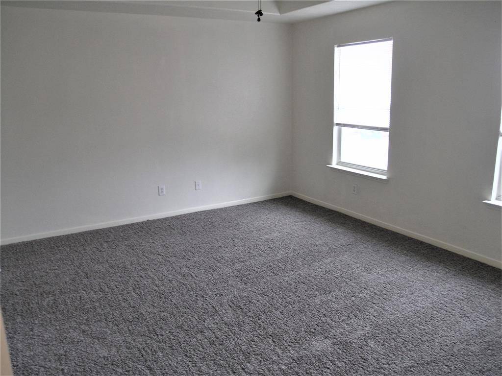 Primary Bedroom is spacious and bright
