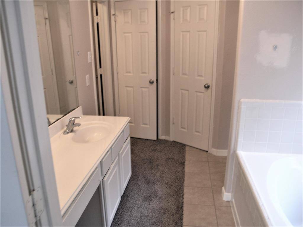 Primary Bathroom with separate Shower and Bathtub