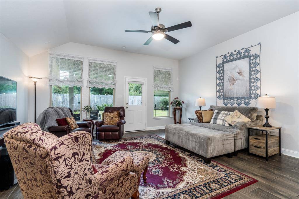 From the family room, you can enjoy a beautiful view of the lush landscaping in the backyard, creating a peaceful and serene atmosphere.