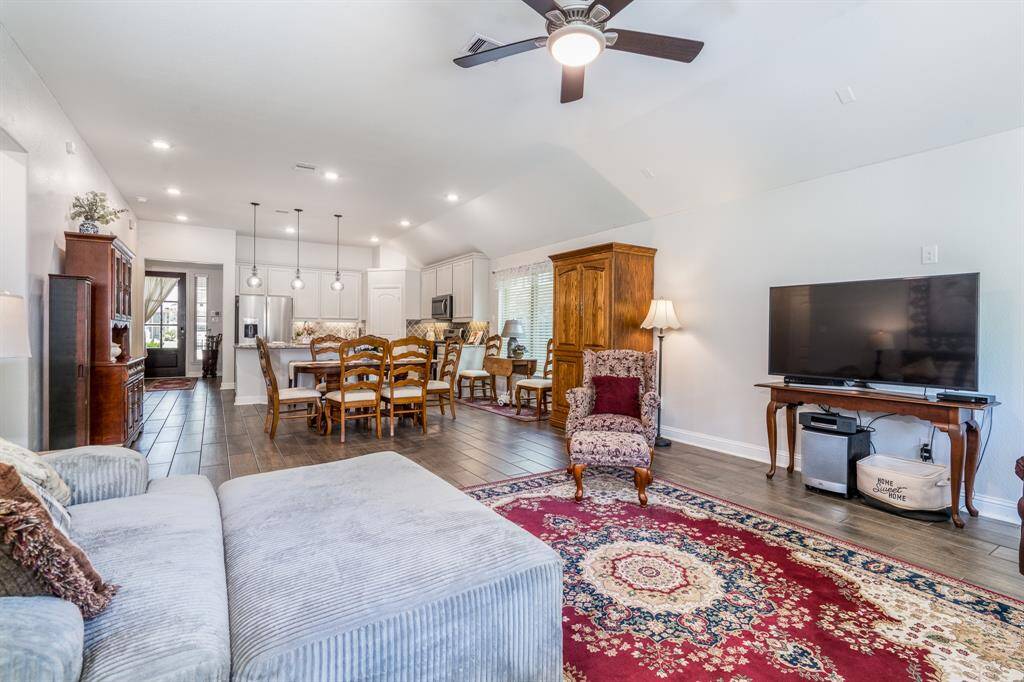 From the family room, you can also enjoy a seamless view of the open concept living areas, enhancing the sense of space and flow throughout the home.