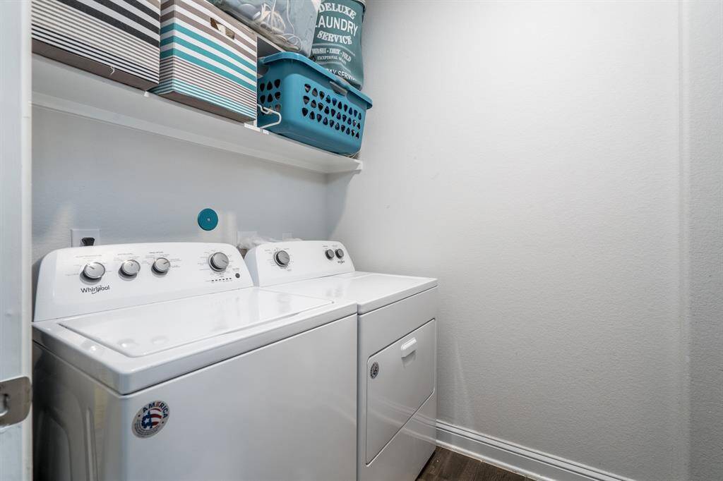 The home includes a spacious laundry room, offering plenty of room for storage and all your laundry needs.
