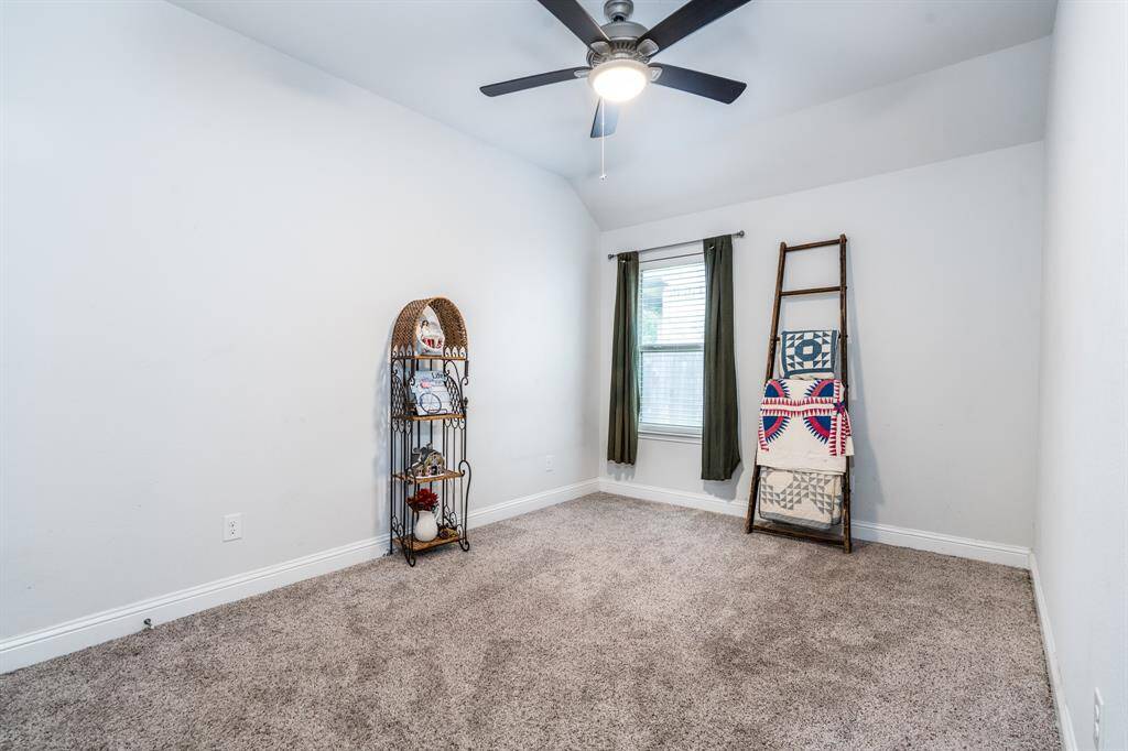 The secondary bedroom offers ample space, perfect for family members or guests,. With plenty of natural light, it provides a comfortable and versatile living area