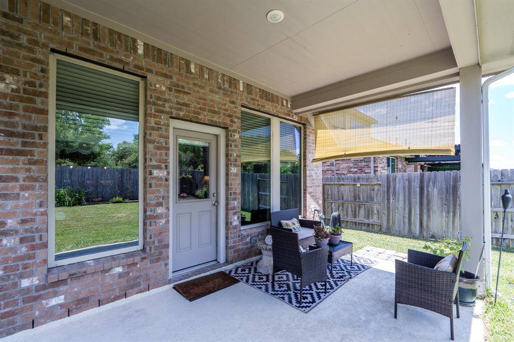 The back patio offers plenty of shade, providing a cool, comfortable space to relax. With no back neighbors, you can enjoy added privacy and tranquility in your own outdoor retreat.