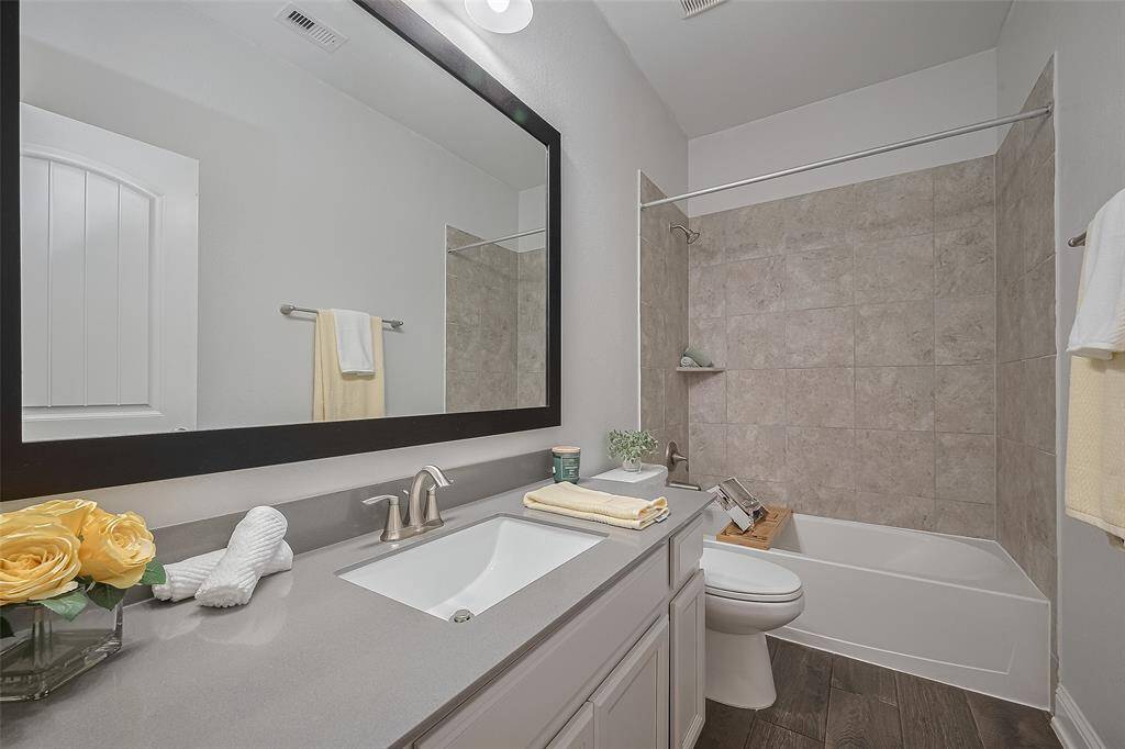 Step outside to the covered patio and private backyard, featuring a relaxing hot tub and a charming pergola — all with no back neighbors, giving you extra privacy and the perfect space to unwind or entertain.