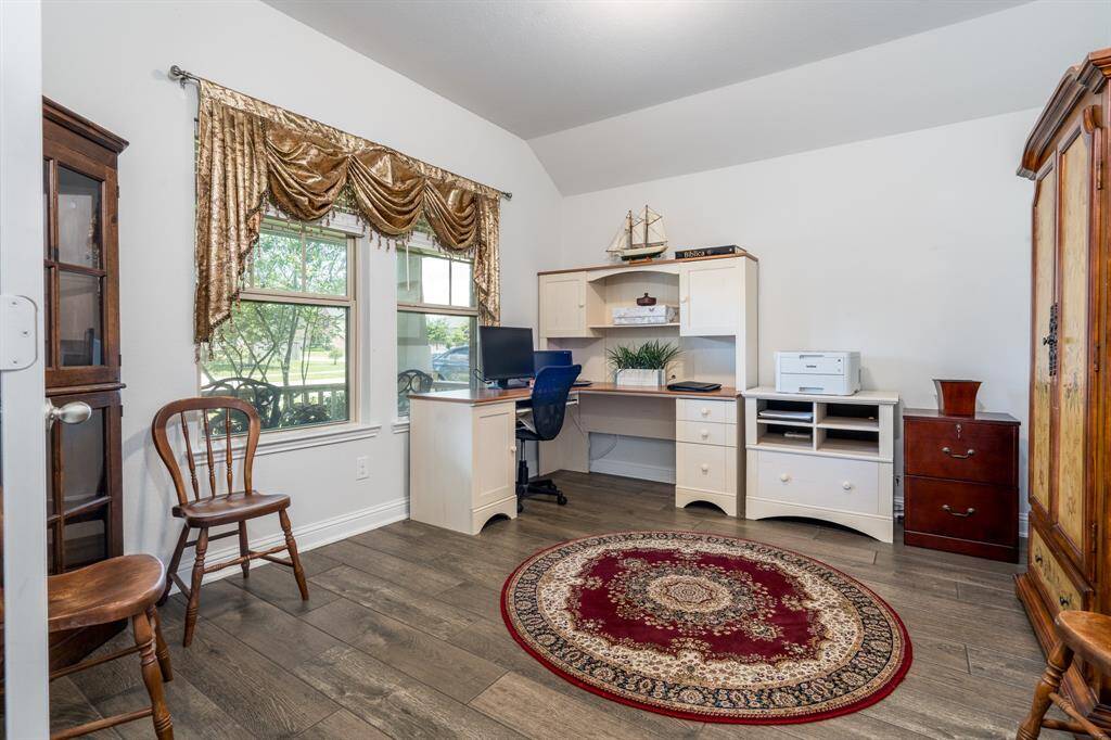 To your left, just off the entry, is a bright and inviting study bathed in natural light—perfect for a home office or reading retreat.