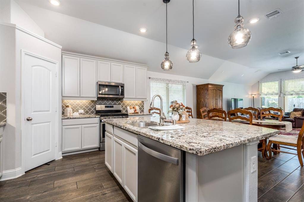 At the heart of the kitchen is a large island—perfect for meal prep, casual dining, and the chef in the family.