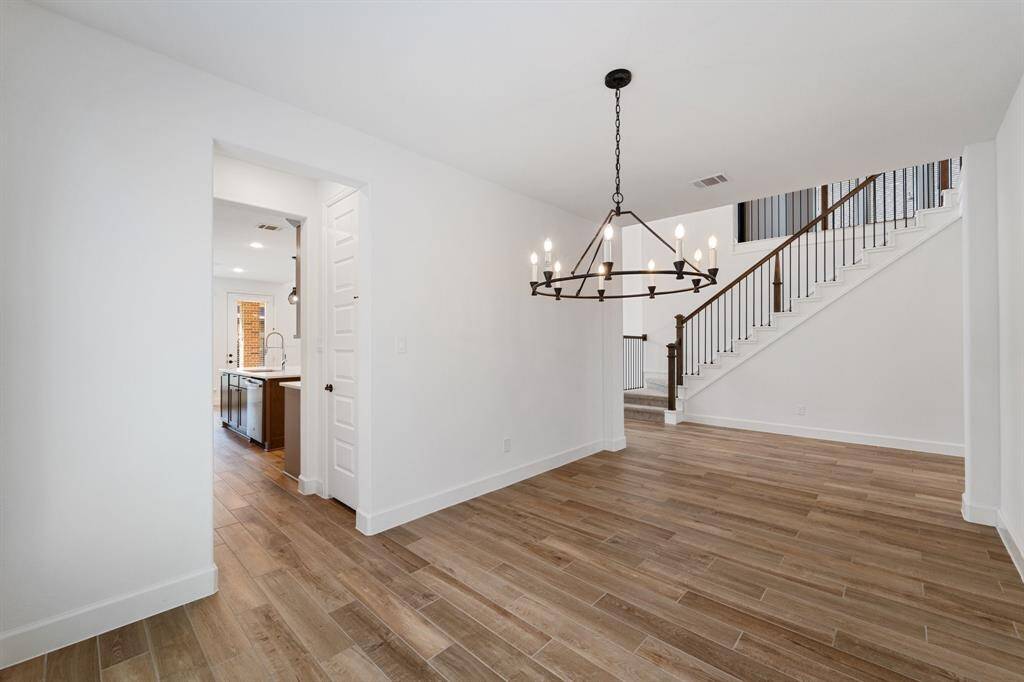 View into kitchen and living room from formal dining