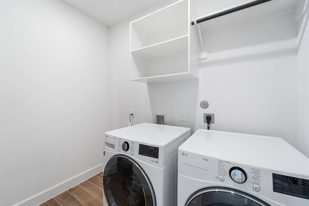 Spacious laundry room with large under stair storage just to the left.