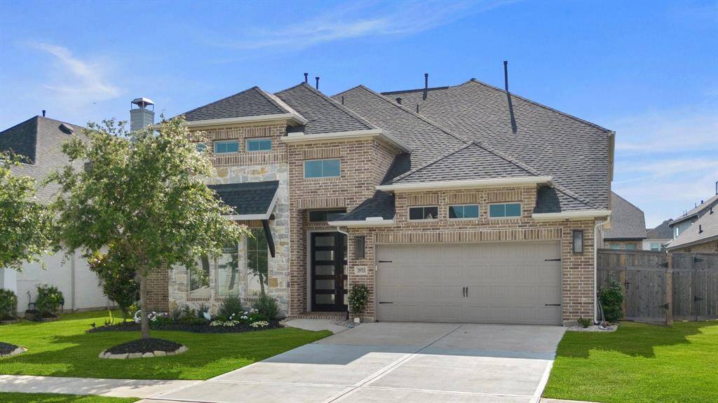 3 car garage and gorgeous elevation.