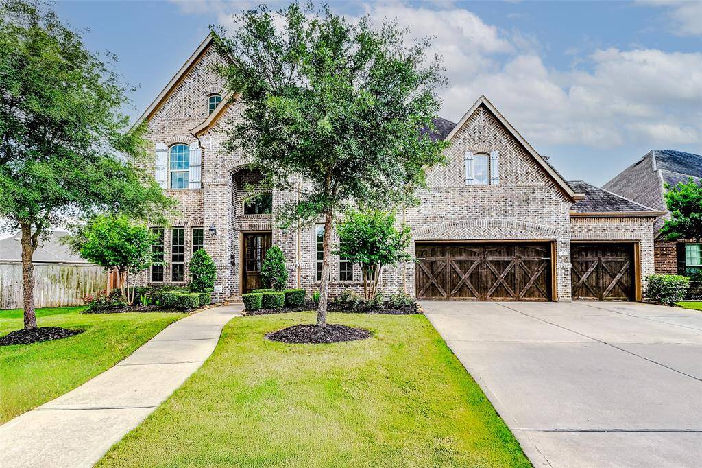 Welcome to 29907 Spring Side Court—an exquisite Coventry Home nestled on a generous HALF-ACRE lot just minutes from the heart of downtown Fulshear. Offering 5 expansive bedrooms, 5 full baths, a powder room, and a spacious 4-car tandem garage.