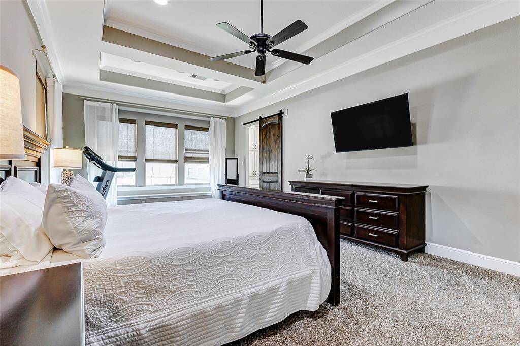 Anchored by plush carpeting, this expansive bedroom effortlessly accommodates a king-size bed, creating an ideal sanctuary for relaxation. A generous wall space offers the perfect spot for a media unit. From here, a sliding door leads you to the luxurious primary ensuite, completing this perfect retreat.