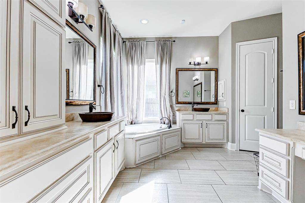 Step into your luxurious, spa-inspired ensuite bathroom, where sleek tile flooring flows effortlessly throughout. Designer finishes elevate the space, transforming it into an indulgent retreat perfect for relaxation and rejuvenation.