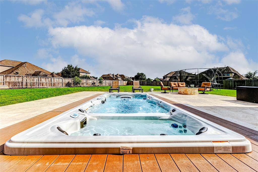 Swim, jog, walk, and exercise year-round in the comfort of your own backyard! The swim spa offers a versatile alternative to a traditional pool, featuring massaging spa jets and customizable water temperatures—perfect for fitness, recovery, and relaxation for the whole family.