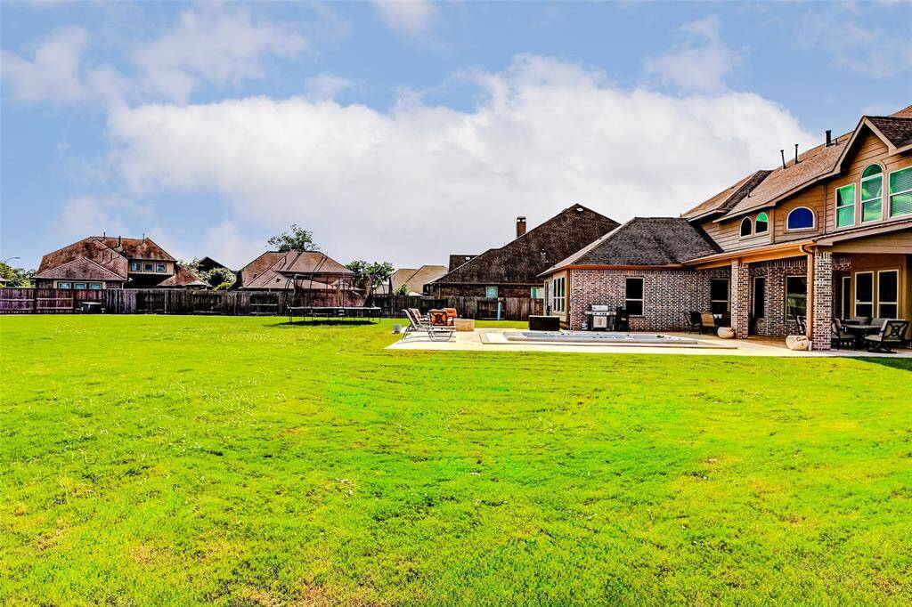 Even with all the thoughtfully designed backyard enhancements, there's still an abundance of green space—perfect for play, pets, or simply enjoying the outdoors.