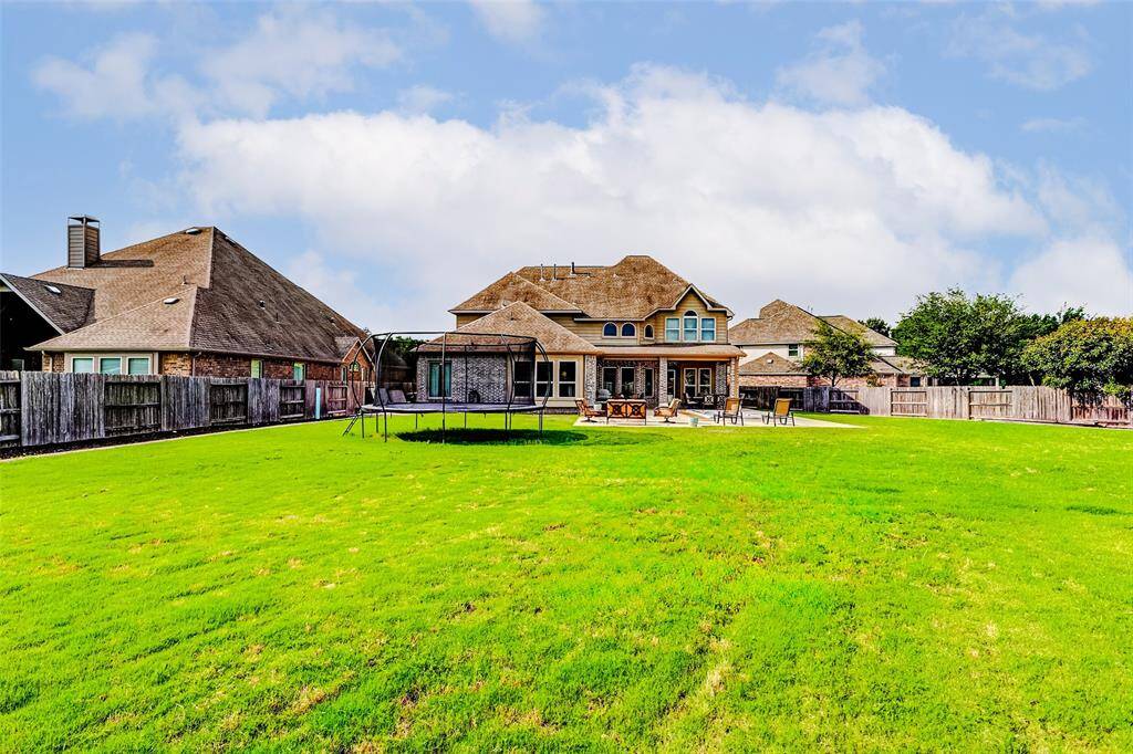 The automatic sprinkler system features 17 zones, ensuring efficient coverage across this expansive lot. Additional upgrades include rain gutters installed in 2021, a new HVAC system replaced the same year, and more thoughtful improvements throughout.