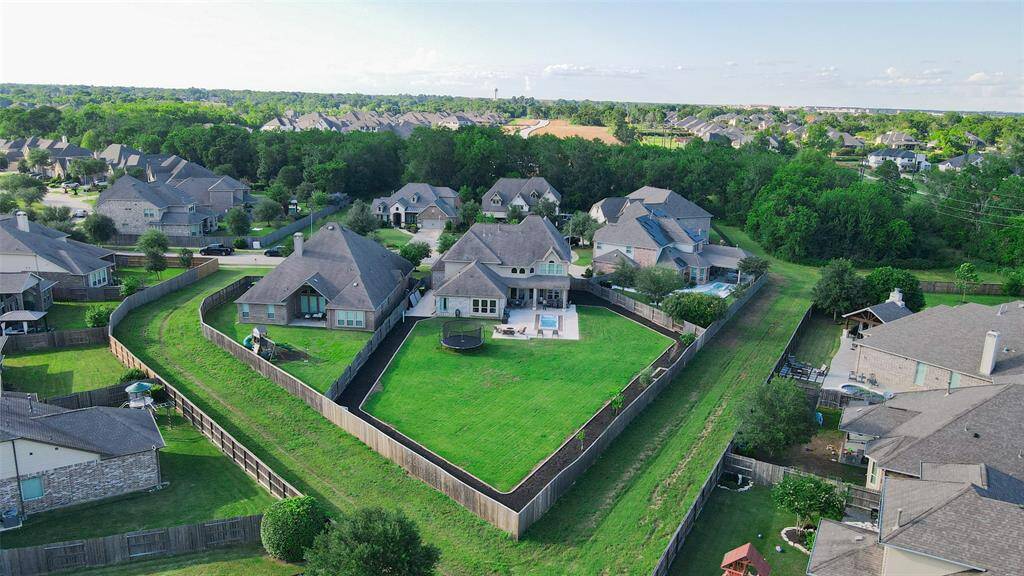 Here’s another view showcasing one of the largest lots in the neighborhood—offering unparalleled space, privacy, and endless possibilities for outdoor living.