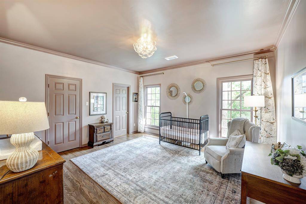 Primary bathroom has marble counters and mosaic marble floor (updated 2024).  Beautiful built-in hutch adds elegant storage.