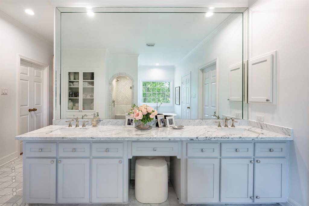 Carrara marble counters and a luxurious spot to get ready for your day