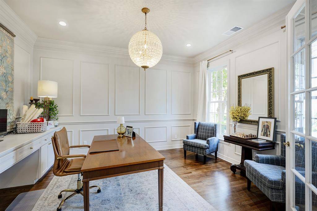 Handsome study off the entry has doors for privacy and a quiet place to work.