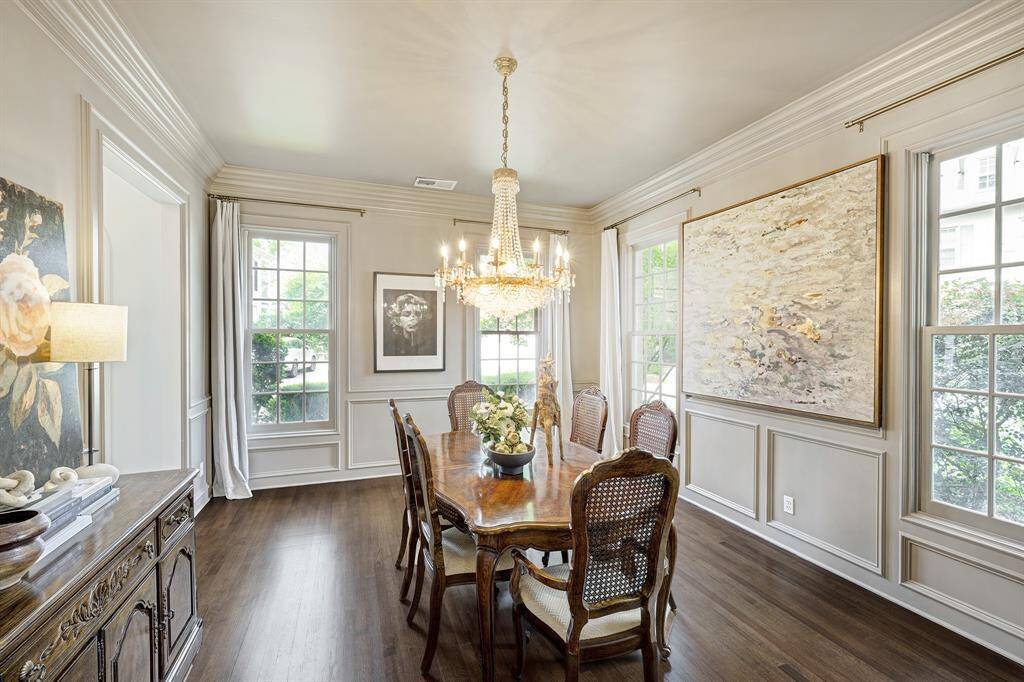 Gracious dining room is ready for hosting large dinner parties! Beautiful trim mouldings!