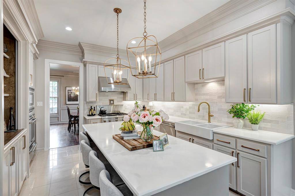 Family room is anchored by a fireplace surrounded by built-ins.  Gleaming hardwood floors refinished in 2024.