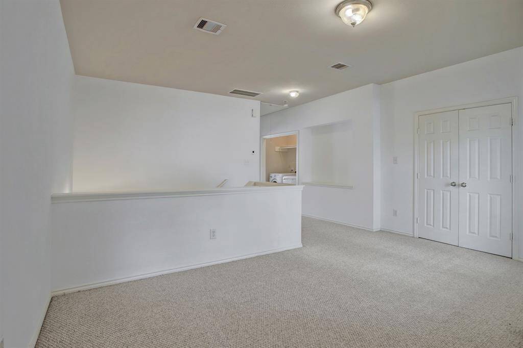 Between the flex space and master bedroom is the utility room with washer & dryer included.