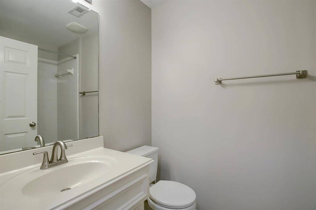 Full bathroom located just outside the bedroom on the first floor.