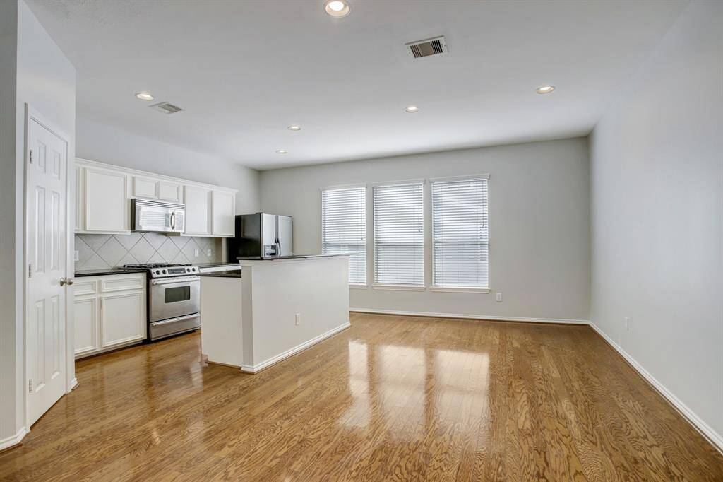 The kitchen is open to the spacious dining area.