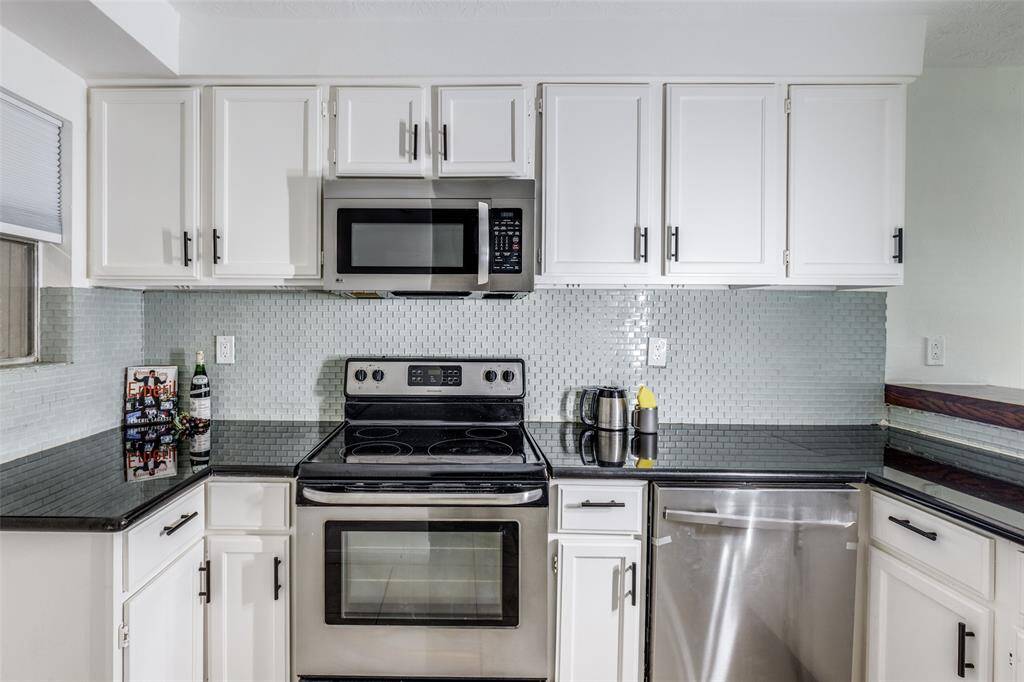 The kitchen is equipped w/ a new S.S. dishwasher (never been used), a S.S. electric oven w/ a smooth top range, plus a built-in microwave