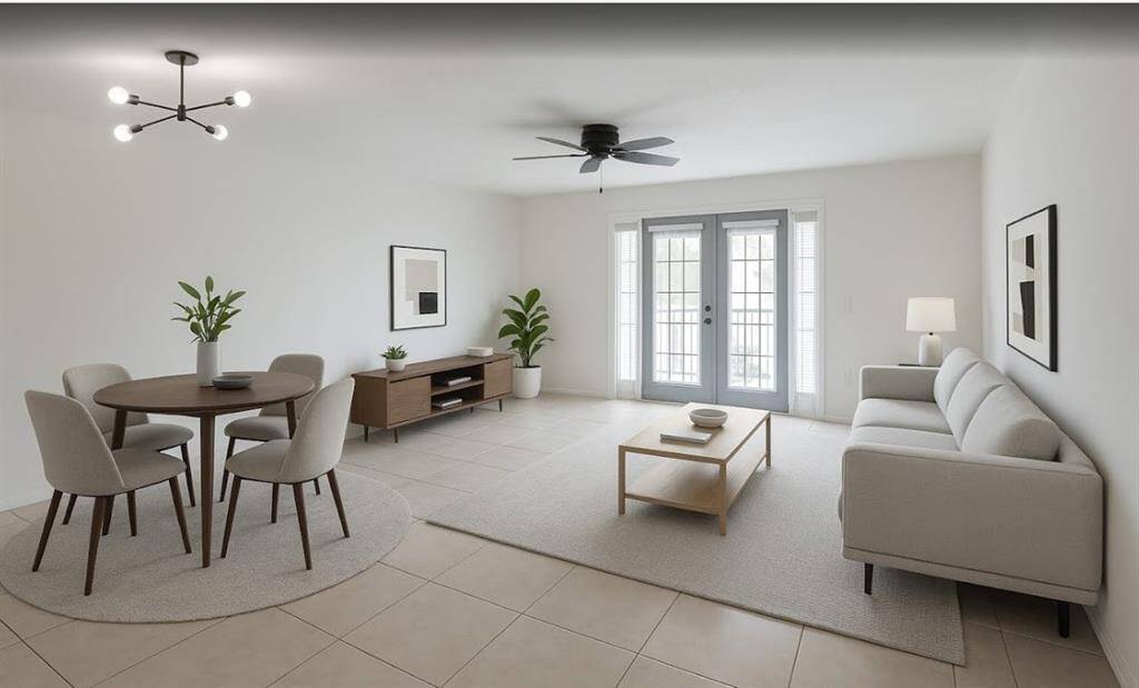 The living  room /dining area is virtually staged for scale