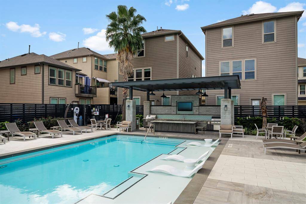 Resort pool and outdoor kitchen and entertaining space