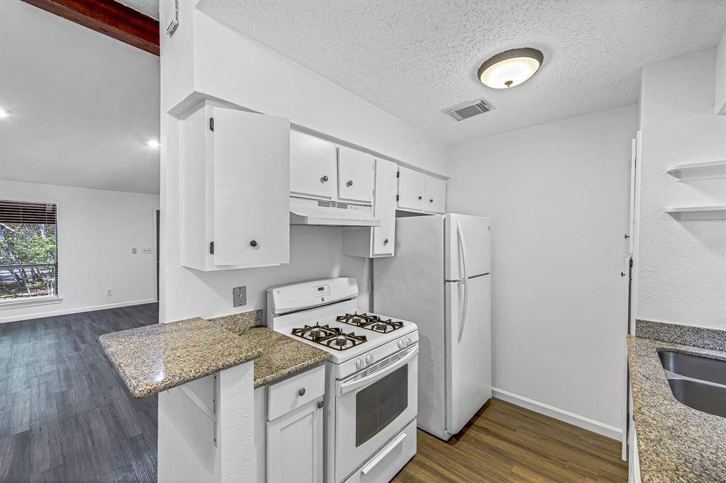 Kitchen also has granite countertops and pantry.