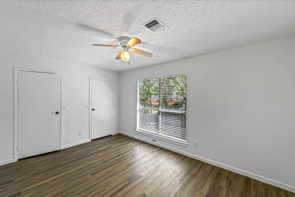 Bedroom looking out to back green space.