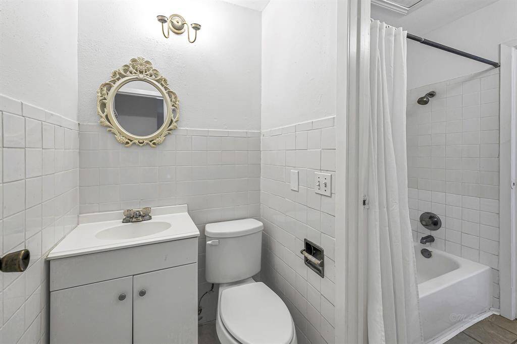 This bathroom connects to the front bedroom