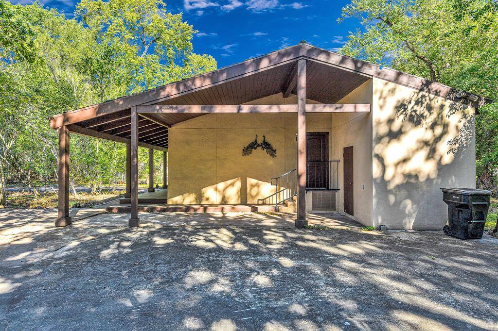 Carport and side entry.