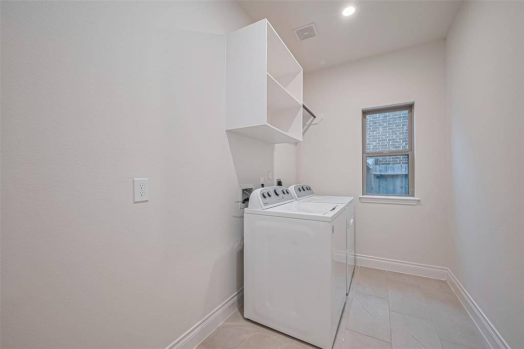 Thoughtfully designed, the home also includes a spacious laundry room...