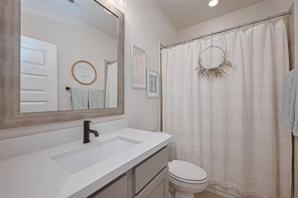 Full bathroom- upgraded counter-tops and vanity mirror.