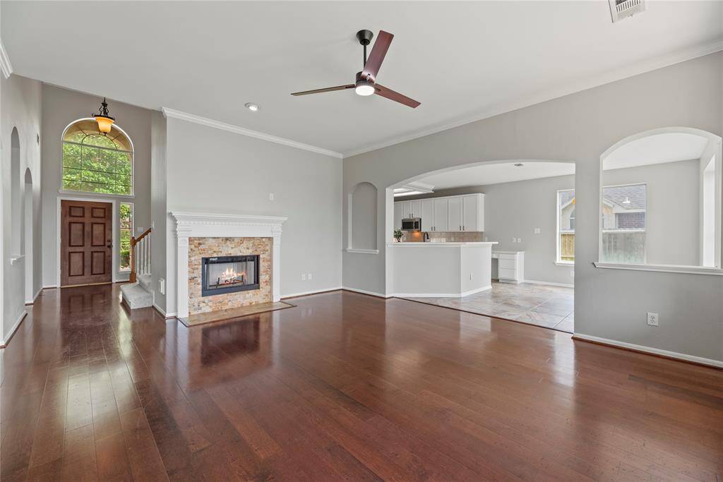 Entertaining is a cinch with an open floor plan. Watch the game in the living room, while others gather in the kitchen around the spread of appetizers, chips, and dip.
